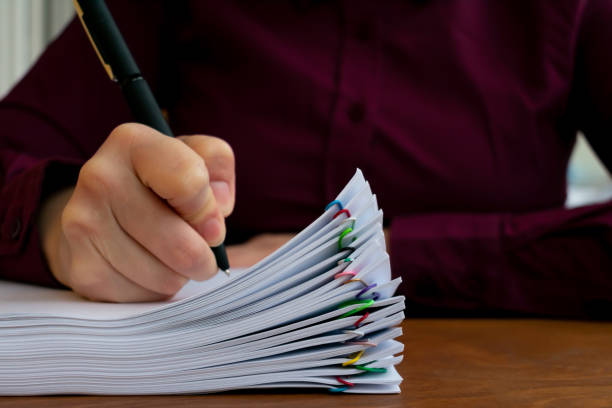 istock Employee making notes. Concept of a big amount of office work 1263065007