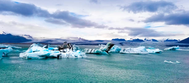 istock Glacier Lagoon, Iceland: Lagoon, Icebergs, Mountains, Dramatic Sky, Panorama 1263067247
