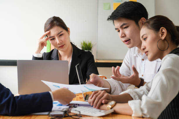 istock Group of Businessman and Accountant checking data document on digital tablet for investigation of corruption account . Anti Bribery concept. 1263073915
