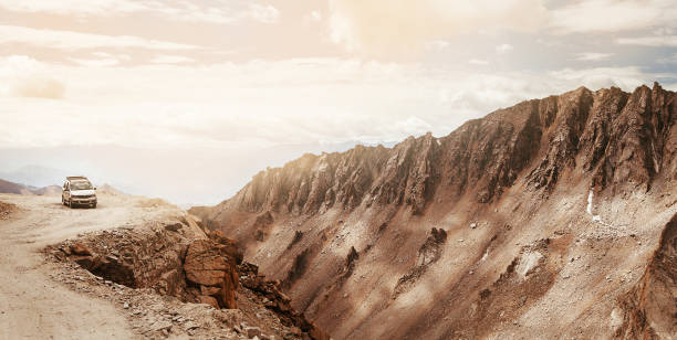istock Off-road vehicle auto going through high altitude Mountain pass on Leh - Manali road in Northern Indian Himalaya, Ladakh region. 1263074326