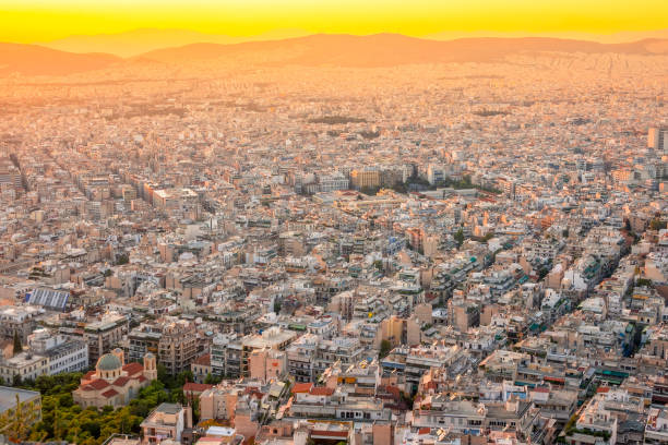 istock Yellow Sunset Over the Rooftops of Athens 1263081935