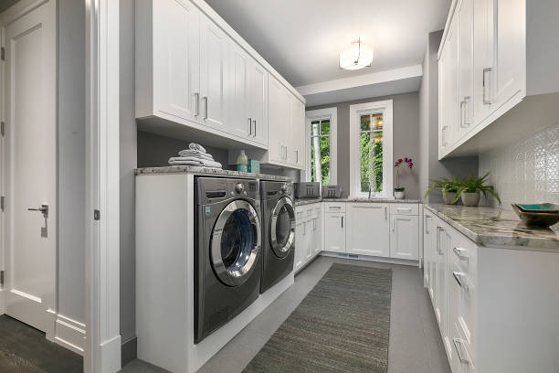 istock Front load washing machine and dryer in new home 1263083369
