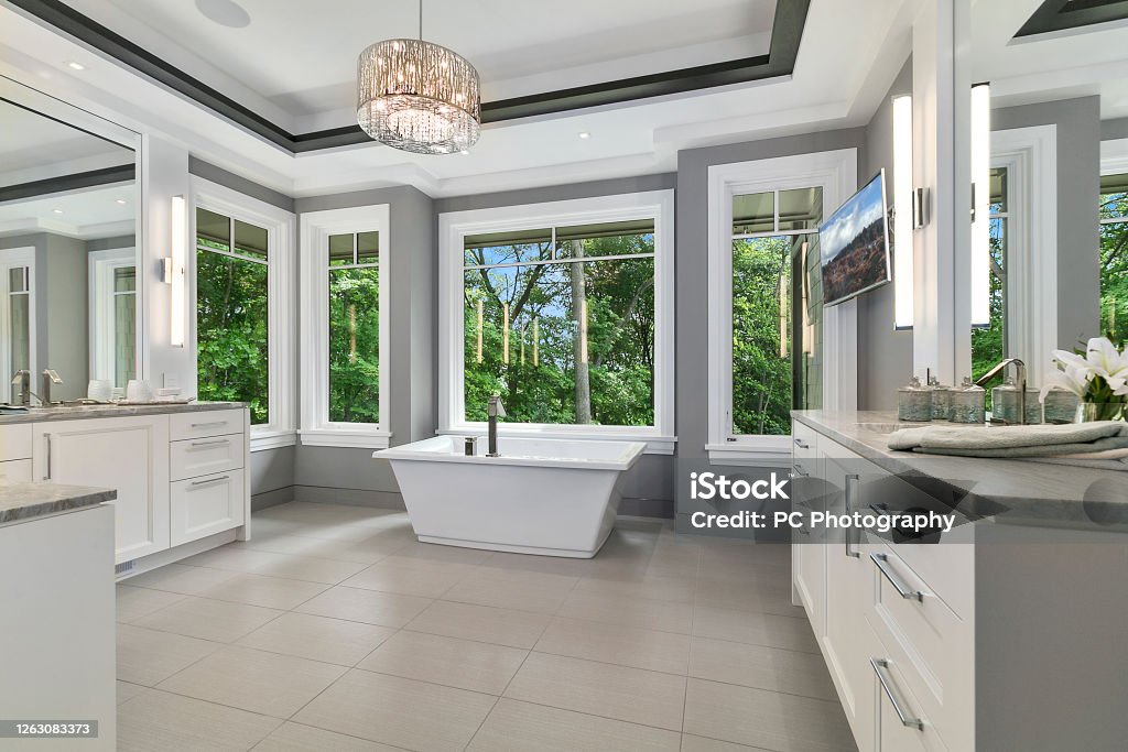 Freestanding bathtub with amazing trim and detail Beautiful new bathroom in new home Bathroom Stock Photo