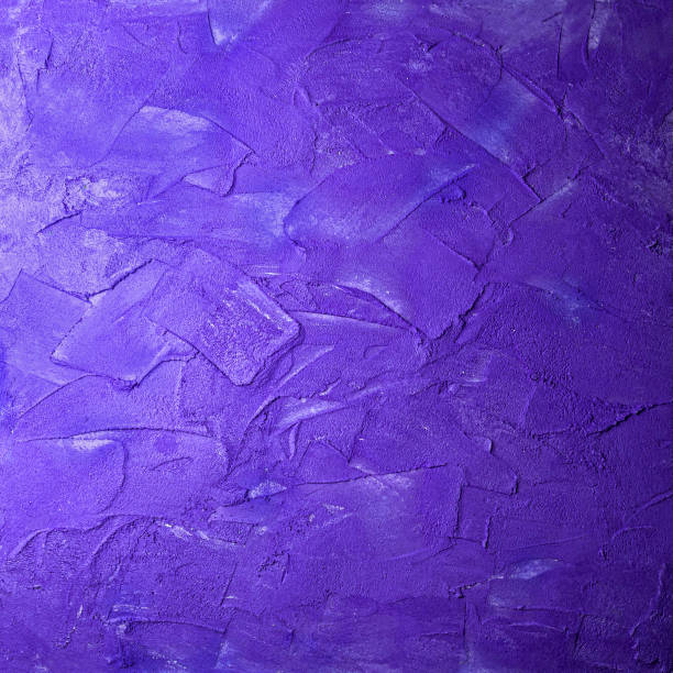 istock Violet square concrete wall smears. Trendy blue textured wall abstract background coating strokes pattern uneven surface plaster 1263085726