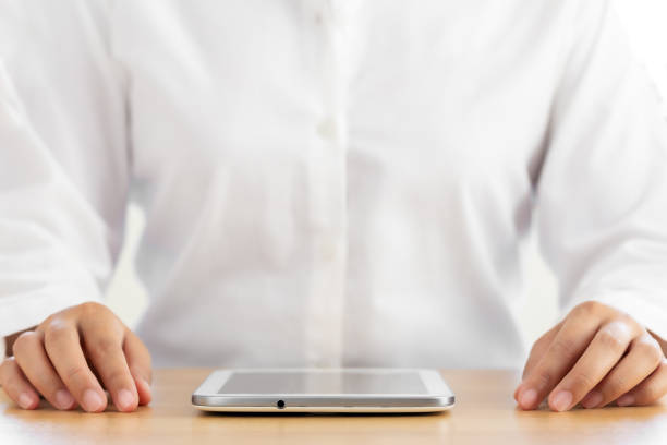 istock Human hand placed beside the laptop on the table. 1263085899
