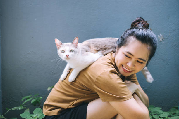 istock A Asian woman enjoying with her cat 1263086263