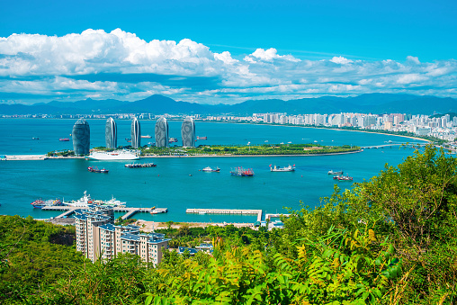 Sanya city, Hainan island. Aerial view of Phoenix Island from Luhuitou Park. Excellent tourism destination for summer vacation. Popular Chinese resort. Paradise island.