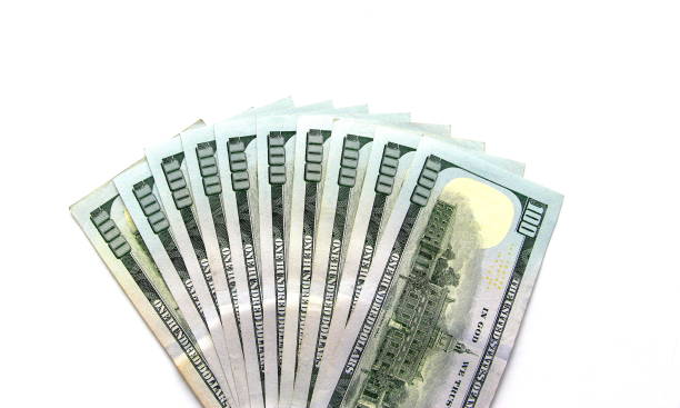 istock One hundred paper dollars on a white background isolated. 1263089203