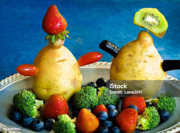 Cute Photo Of Organic Fruit And Vegetables Against Blue Background Stock Photo - Download Image Now