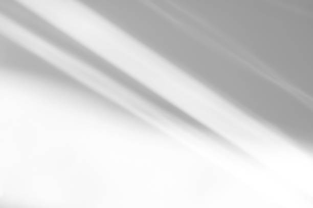 istock diagonal shadow and rays of light on a white background 1263089877