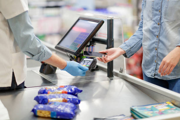 istock Contactless payment by smart phone on the reader at supermarket checkout 1263093921