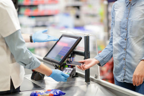 istock Contactless payment by mobile phone on the reader at supermarket checkout 1263093922