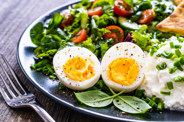istock Breakfast - boiled egg, homemade bread, cottage cheese and vegetables 1263093960