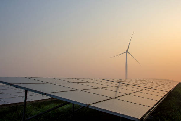 istock Wind power and solar power plants at sunrise and sunset 1263095047