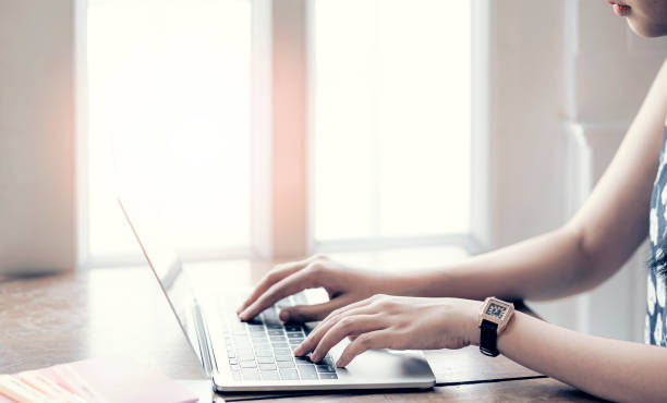 istock woman working from home, using laptop while sitting at home. 1263096929