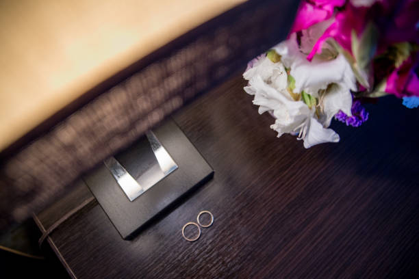 istock wedding rings on a wooden table 1263097986