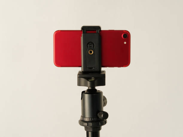 istock Using smartphone like professional photo camera on tripod. 1263098858