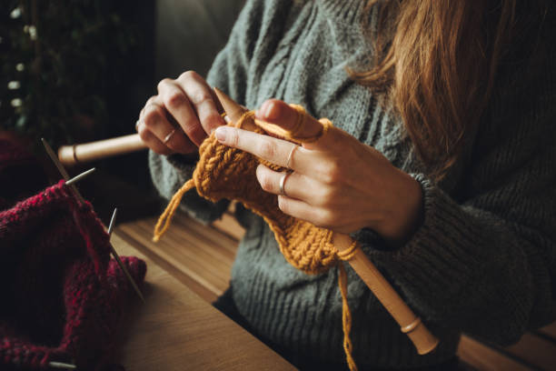 istock Close up on woman's hands knitting 1263101598