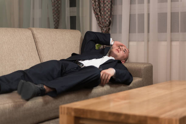 istock Young Businessman Resting on Sofa at Home 1263101696