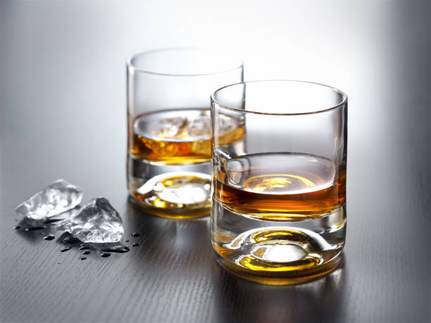 istock Two Glasses of Whiskey and Ice 1263101861