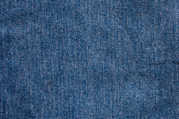 istock Denim blue jeans texture close up background top view 1263102028