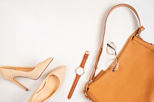 Flat lay with woman fashion accessories in neutral colors. Beauty blog, style, trends. Top view, copy space