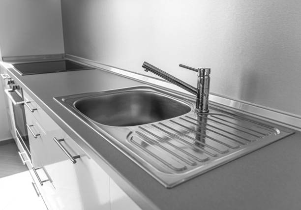 istock Kitchen sink and faucet on an kitchen worktop. 1263105555