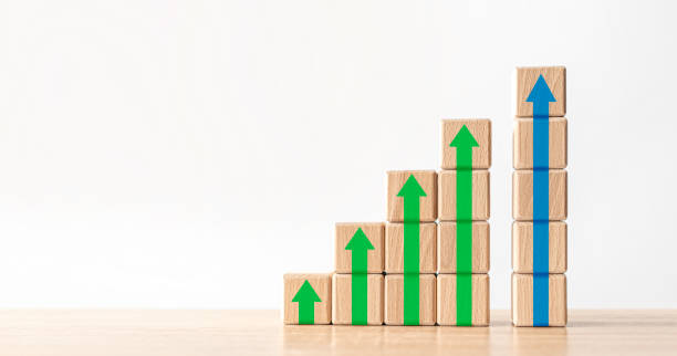 istock Wood block stacking as step stair with arrow up. 1263105562