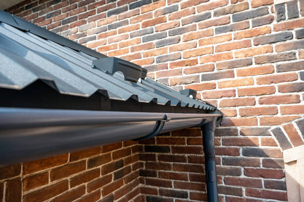 . Gutter system for a metal roof. Holder gutter drainage system on the roof. Gutter system for a metal roof. Holder gutter drainage system on the roof. downspout stock pictures, royalty-free photos & images