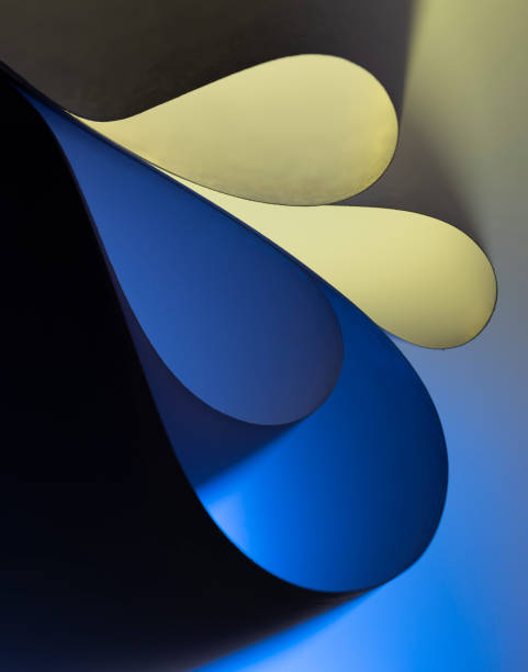istock Yellow and blue paper sheet waves 1263108980