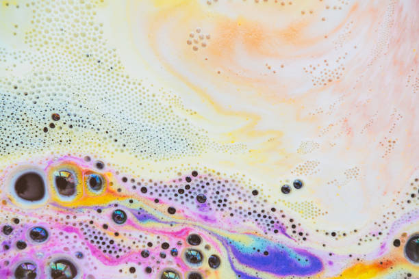 istock Beautiful bath foam with rainbow colors in the water. Galaxy imagination. Marble texture. Flat lay, top view, directly above. 1263109784