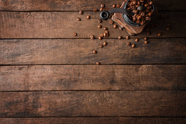 istock Vintage coffee grinder on wooden table. Top view 1263110771