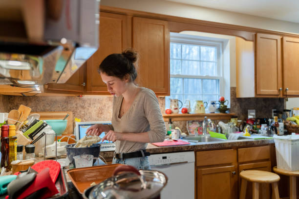 istock Young woman preparing the batter for her pie 1263114183