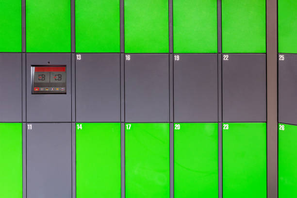 istock Outdoor green automated public lockers with touchscreen display. Autonomous post parcel terminal.Self-service street cloackroom cell machine 1263119157