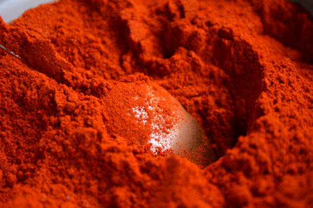 istock powdered dried red pepper with a spoon close up 1263122144