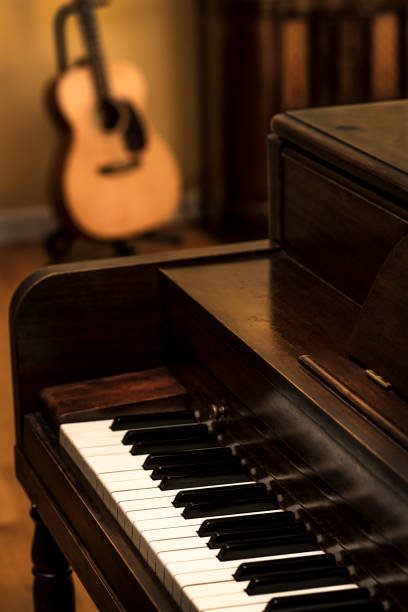 close-up piano keys, upright piano, acoustic guitar, old radio - 1930s style radio retro revival old fashioned imagens e fotografias de stock