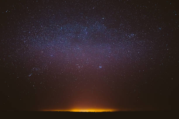 istock Real Night Sky Stars Background With Natural Colourful Sky Gradient. Sunset, Sunrise Light And Starry Sky. Yellow And Black Colors 1263122390