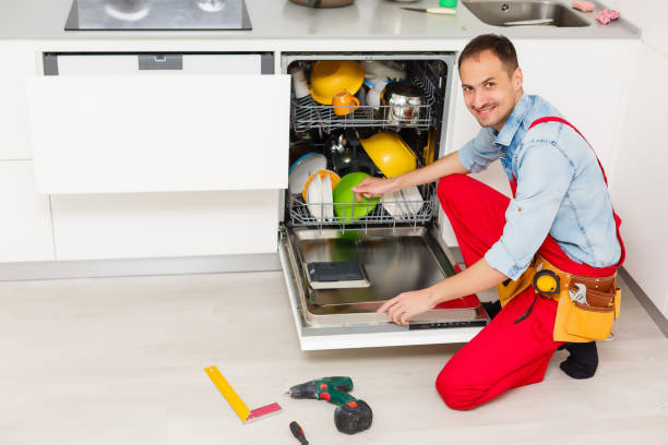 istock Male technician checking dishwasher with digital multimeter in kitchen 1263122945