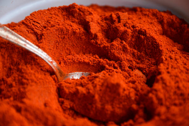 istock powdered dried red pepper with a spoon close up 1263123007