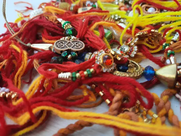 selective focus on Rakhee or holy thread on Indian festival Raksha Bandhan
