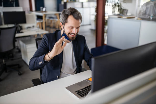Businessman having video call at work