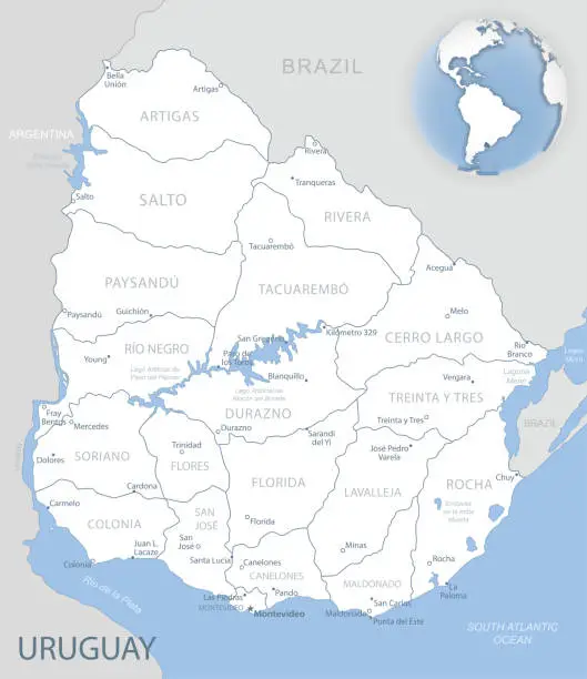 Vector illustration of Blue-gray detailed map of Uruguay administrative divisions and location on the globe.