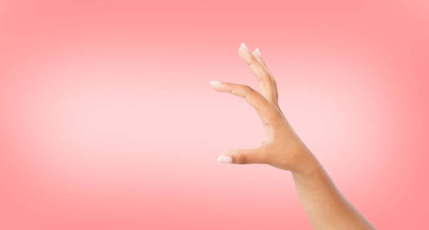 istock black hand measuring invisible items or hold something, isolated on pink background.Woman's palm making gesture while showing small amount of something, side view, close-up 1263127292