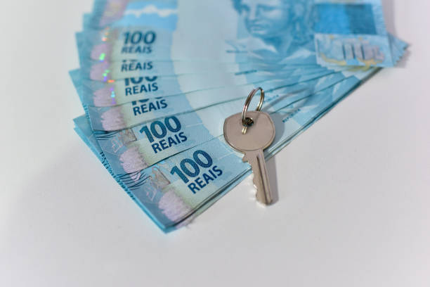 istock Brazilian money and house key 1263128254