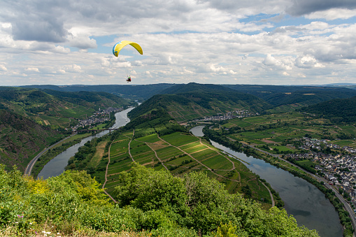 Paraglider above the Mosel loop in Bremm, Germany