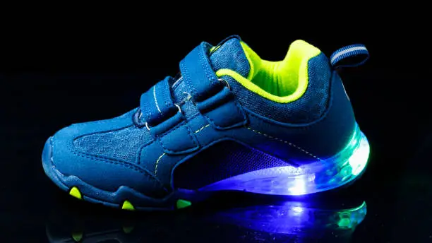 Photo of children's sneaker shoe with led light illumination