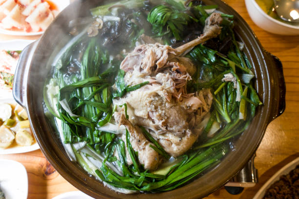 istock korean chicken soup with mushrooms and chives. 1263130974