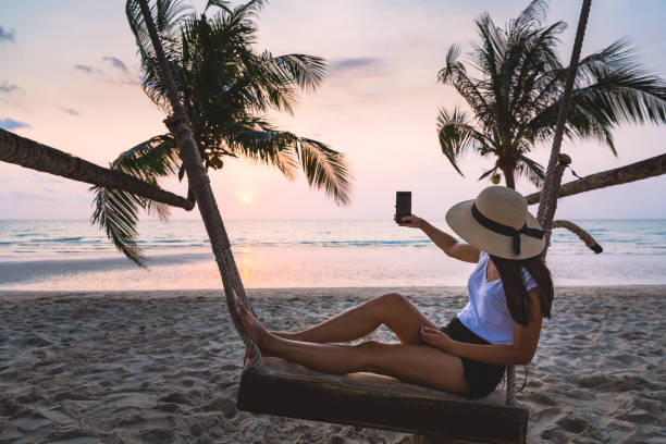 istock Woman on swing in beach 1263131024