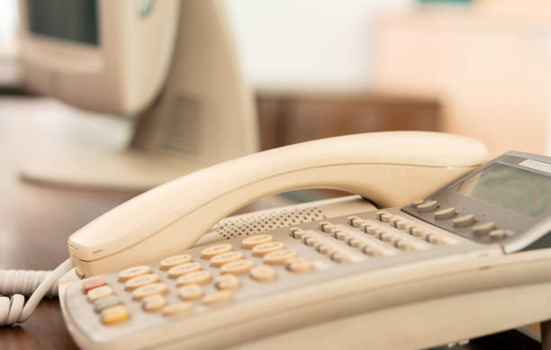 closeup old office telephone on the desk