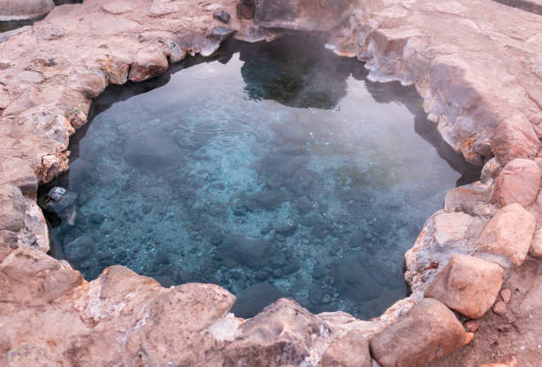 istock Hot spring river with steam fog limestone 1263135420